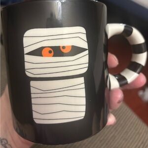 HD Designs Holiday Black Halloween Mummy Mug with Striped Handle small chip